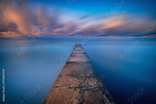 Long exposure seascape fine art photograph of pier on a sunrise in Paphos, Cypru Poster Mural XXL