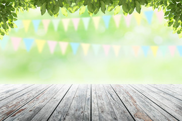 Wall Mural - Empty wooden table with party in garden background blurred.