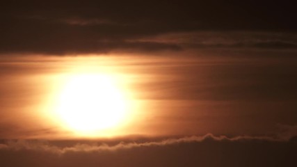 Wall Mural - Sunrise Through Cloud Layers On Warm Sky Timelapse