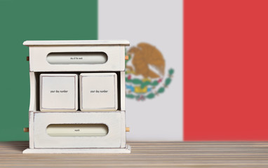 Fototapete - Wooden retro calendar with free space for a date on the background of the flag of Mexico. Template for writing the dates of the national holidays of Mexico with free text space