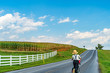 Amish country farm field agriculture, boy on a scooter in Lancaster, PA US