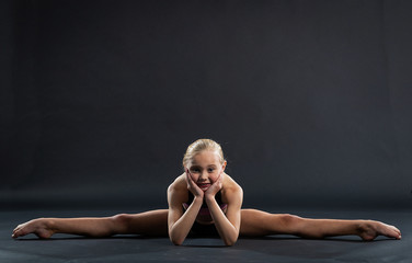 portrait of young giril doing the splits
