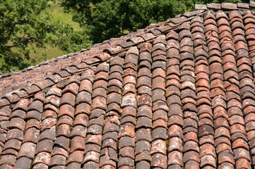 Wall Mural - Old vintage red ceramic roof tiles closeup as background