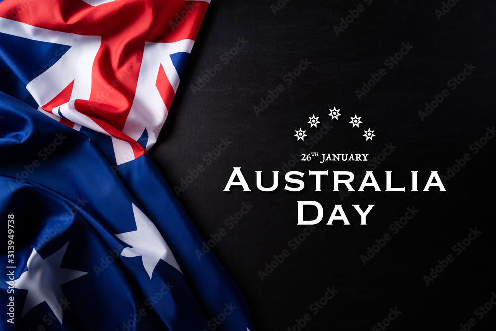 Australia day concept. Australian flag with the text Happy Australia day against a blackboard background. 26 January. - obrazy, fototapety, plakaty 