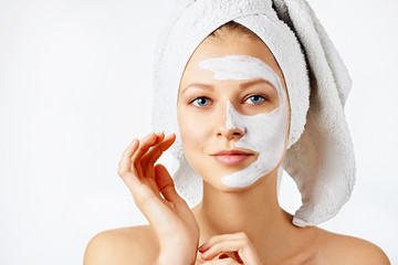 Wall Mural - cosmetology, skin care, face treatment, spa and natural beauty concept. woman with facial mask.