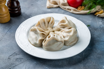 Poster - Khinkali with lamb on wooden table