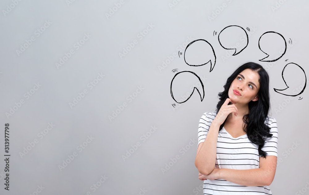 Speech bubbles with young woman in a thoughtful face - obrazy, fototapety, plakaty 