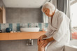 © Yakobchuk Olena - Upset old lady feeling pain in her knee