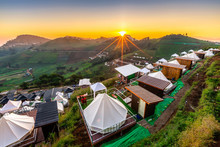 Beautiful View Of White Camping Tents With Mon Jam Mountain Landscape And Resorts At Sunrise In The Morning For Tourists Rest On Vacation At Mae Rim In Chiang Mai, Thailand