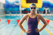 © primipil - Young woman swimmer portrait getting ready for competition in swimming pool