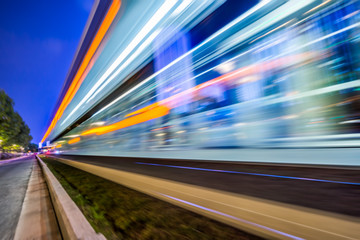 Wall Mural - Vehicle light trails in city at night.