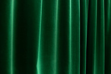 Dark Depp Green Curtains With Soft Folds - Horizontal Close Up Photo With Selective Focus. Perfect Background