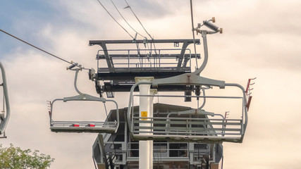 Wall Mural - Pano frame Chairlifts and chairlift terminal on top of a mountain in Park City in summer