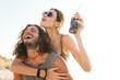 © Drobot Dean - Photo closeup of laughing caucasian man piggybacking nice woman