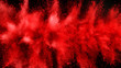 Explosion of red powder isolated on black background