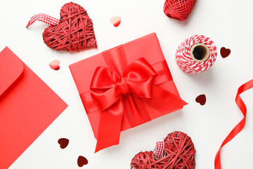 Gift box on decorative white background, top view