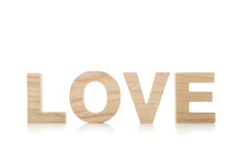 Love Made Of Wooden Letters Isolated On White Background