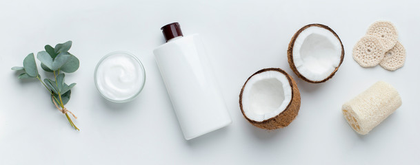 Wall Mural - Homemade coconut products on white table background