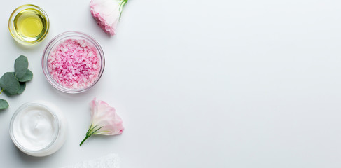 Wall Mural - cosmetic products in jars of rose petals and pink salt