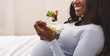 Close up of pregnant lady eating healthy food