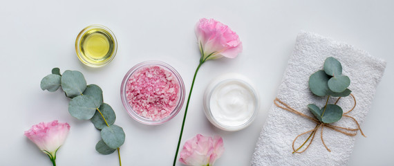 Wall Mural - moisturizing cream, essential oil and salt on white background