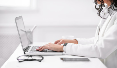 Poster - Cropped image of hispanic girl working on laptop