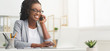 © Prostock-studio - Black Businesswoman Talking On Cellphone And Using Laptop In Office, Panorama