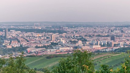 Poster - Skyline of Vienna from Danube Viewpoint Leopoldsberg aerial timelapse. Downtown with prater, skyscrapers and historic buildings at evening before sunset