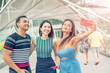 © jovannig - Three asian friends walking along the city taking selfies. Tourism and holiday concept