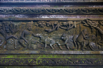 Wall Mural - An ancient stone carving in Sacred Monkey Forest Sanctuary in Ubud at Bali, Indonesia