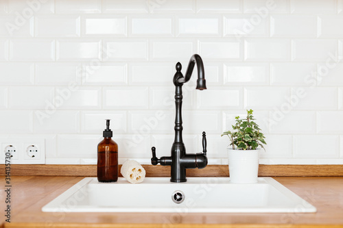 Fotomural Kitchen with white sink and black faucet wooden countertop