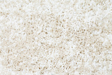 Plush Fluffy Beige Carpet Texture. Bright Fabric Background.