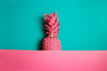 Wall Mural - Color pineapple on pink and blue background. Surreal minimalistic art