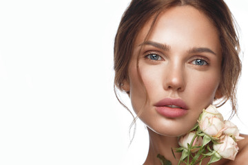 Wall Mural - beautiful woman with classic nude make-up, light hairstyle and flowers. beauty face.