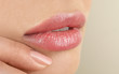 Leinwandbild Motiv Woman with beautiful full lips on beige background, closeup