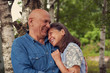 © DariaTrofimova - cute older man and woman in birch grove