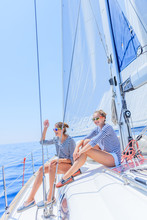 Two Beautiful Girls Relaxing On Yacht In Greece
