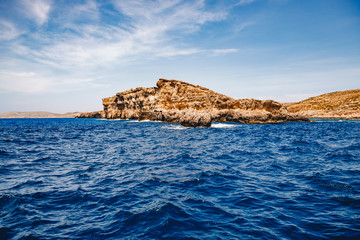 Wall Mural - Panorama beach Blue Lagoon Comino Malta. Rocky coast with window and arch Mediterranean Sea