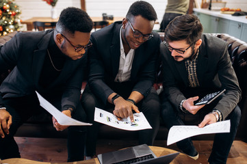 Poster - Colleagues are studying business strategy and build a business plan while sitting at the table in the office. Exchange. Stock. Finance