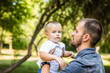 © F8  \ Suport Ukraine - Dad and son having fun in park in summer day. Family.