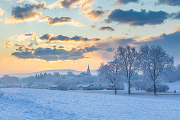 Snowy Sunrise Over A  Rural Church