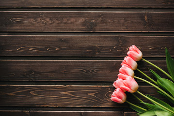 Wall Mural - pink flowers tulips on wooden table for greeting card template