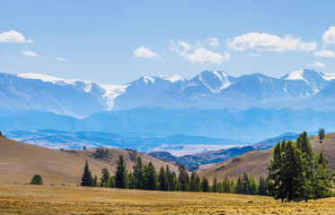 Sticker - Scenic view, Altai mountain. Snow-capped peaks in blue haze. Travel and vacation in the mountains.