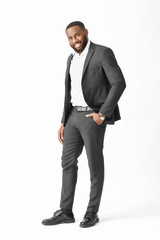 Wall Mural - Stylish African-American man on white background