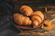 © Pixel-Shot - Plate with tasty fresh croissants on table