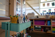 Teal Cart Filled With Jars Of Colored Pencils For An Elementary School Art Class