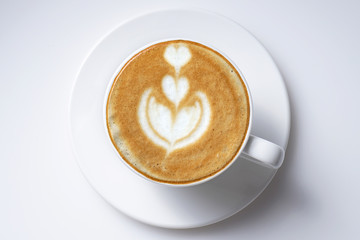 Cup of coffee latte art from top close up  isolated on white with space