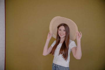 Beautiful elegant lady in hat studio shot. Abstract background horizontal view summer vacation concept