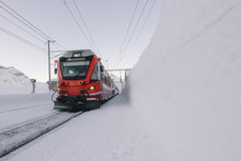Grisons Red Train In The Middle Of A Lot Of Snow