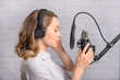 © Anton - The girl writes a podcast, writes an audiobook, an announcer. The sound of films, cartoons. Blogging and reading text into a microphone